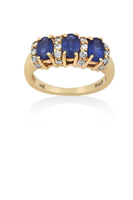 Lot 2149 - A Sapphire and Diamond Ring the three oval cut...