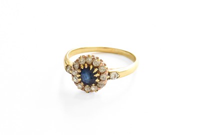 Lot 262 - A Sapphire and Diamond Cluster Ring, the round...