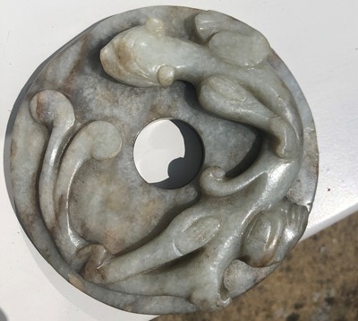 Lot 126 - A Chinese Jade Disc, carved with a mythical...