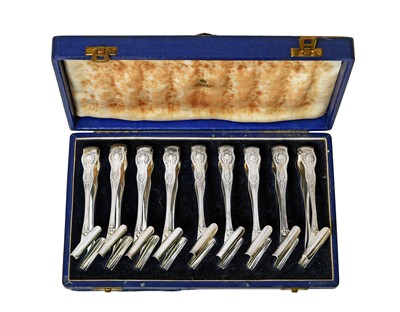 Lot 2023 - A Cased Set of Nine Edward VII Silver Individual Asparagus-Tongs