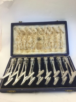 Lot 2023 - A Cased Set of Nine Edward VII Silver Individual Asparagus-Tongs
