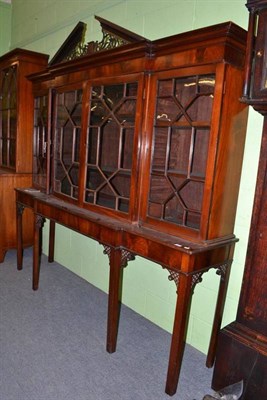 Lot 460 - A mahogany breakfront display cabinet, with astragal glazed doors, raised on associated table...