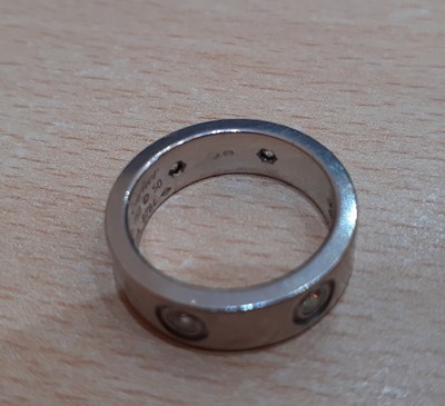 Lot 2299 - A Diamond Set 'Love' Ring, by Cartier the...