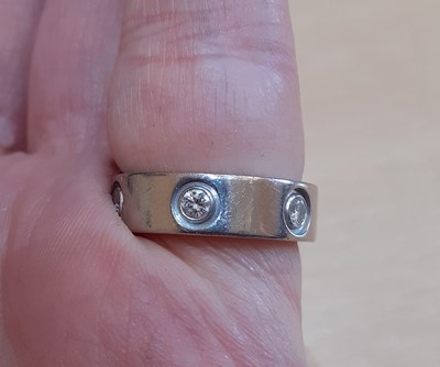 Lot 2299 - A Diamond Set 'Love' Ring, by Cartier the...
