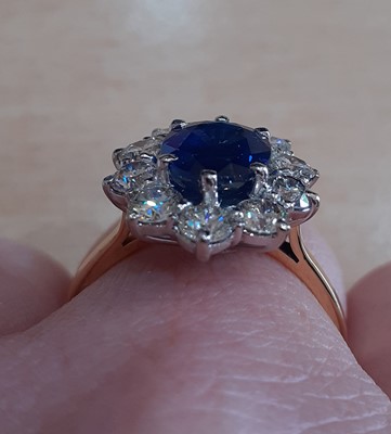 Lot 2319 - An 18 Carat Gold Sapphire and Diamond Cluster...