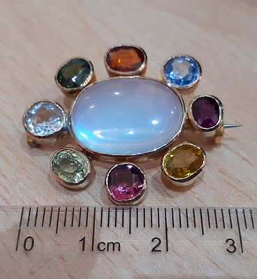 Lot 2113 - A Multi Gem-Set Brooch the oval cabochon...