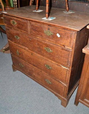 Lot 486 - A George III oak four height chest of drawers