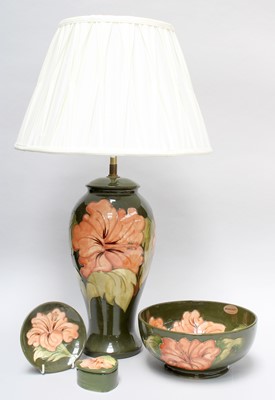 Lot 25 - A Walter Moorcroft Coral Hibiscus Pattern Lamp,...