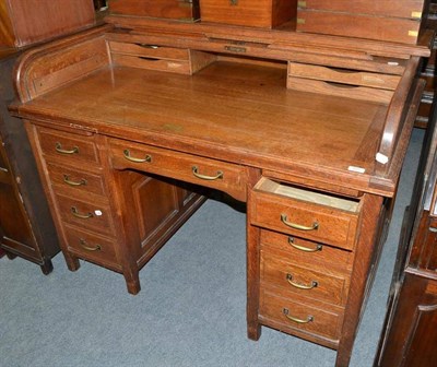 Lot 492 - An Edwardian oak roll top desk