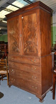 Lot 498 - A George III mahogany linen press with blind fret frieze