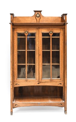 Lot 647 - An Arts & Crafts Inlaid Oak Glazed Bookcase,...