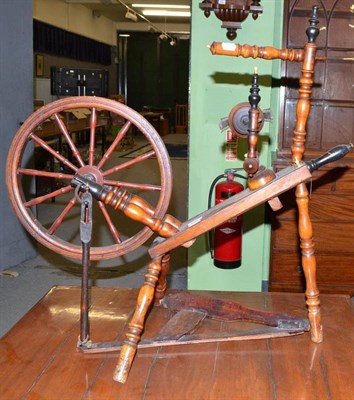 Lot 505 - A 19th century fruitwood turned spinning wheel