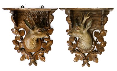 Lot 163 - A Pair of Black Forest Carved and Painted Wood...