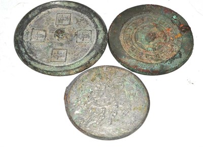 Lot 199 - A Chinese Bronze Mirror, in Tang style, the central boss within a band of symbols and ropetwist...