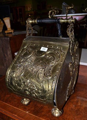 Lot 508 - A Victorian brass coal bin with applied scrolling decoration and a shovel