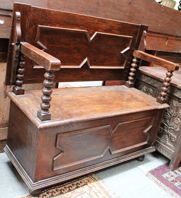 Lot 1155 - An Oak Monks Bench, with moulded panels and...