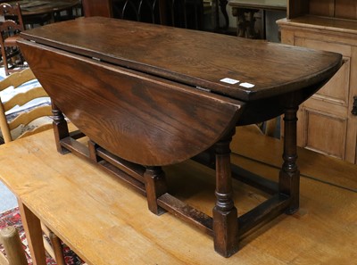 Lot 1213 - A Reproduction Oak Drop Leaf Coffee Table,...