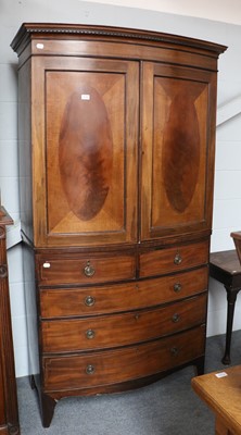 Lot 1138 - A Mahogany Bow Front Linen Press, early 19th...