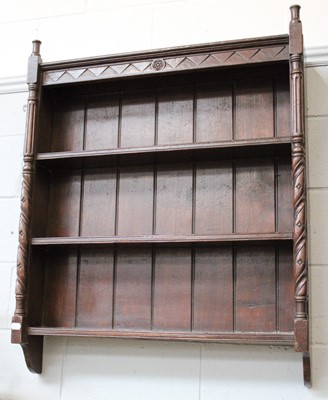 Lot 1245 - A Carved Oak Hanging Enclosed Bookcase, with...