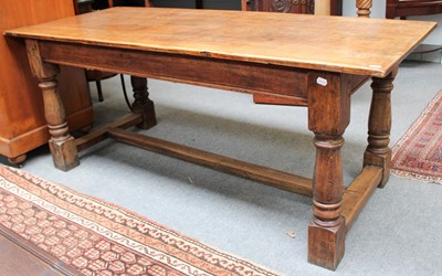 Lot 1143 - An Oak Plank Top Refectory Table, with turned...