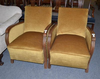 Lot 519 - A pair of French Art Deco oak framed tub chairs