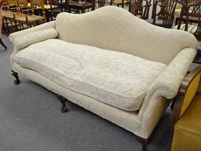 Lot 520 - An early 20th century three-seater settee in George III style with ball and claw feet