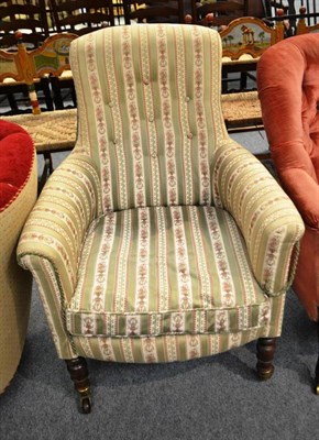 Lot 522 - A Victorian green and floral upholstered armchair