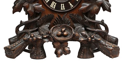 Lot 689 - A Black Forest Striking Cuckoo Table Clock,...