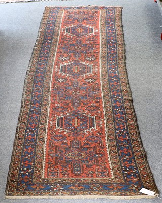 Lot 1094 - A Narrow Karajah Runner, the terracotta field...