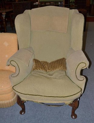 Lot 531 - Walnut wing armchair in olive check fabric with squab cushion