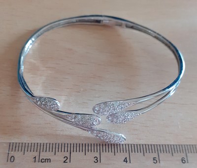 Lot 2127 - An 18 Carat White Gold Diamond Bangle the...