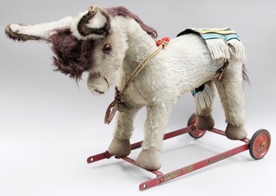 Lot 305 - A Merrythought Donkey on wheels, two large...