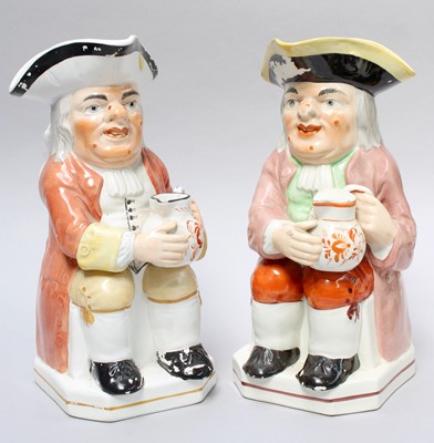 Lot 64 - A 19th century Pottery Toby Jug; together with...