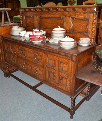 Lot 543 - A reproduction oak sideboard