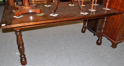 Lot 549 - A reproduction oak dining table