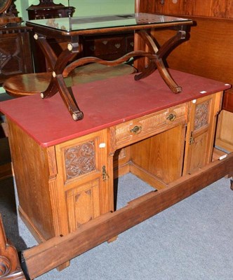 Lot 558 - An Edwardian light oak pedestal desk with a later top and an occasional table