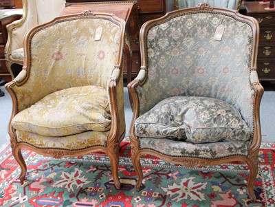 Lot 1209 - A Pair of French Carved Walnut Salon Chairs...