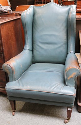 Lot 1174 - A Late 19th Century Leather Wing Chair