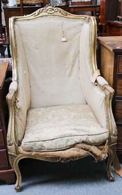 Lot 1214 - A Large 19th Century Giltwood French Wing Chair