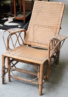 Lot 1361 - A Vintage Rattan Reclining Armchair, with pull-...