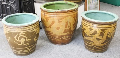 Lot 1297 - A Pair of Chinese Earthenware Planters, slip...