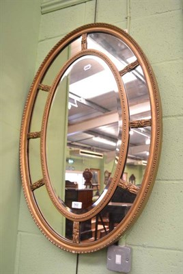 Lot 562 - Edwardian oval mirror