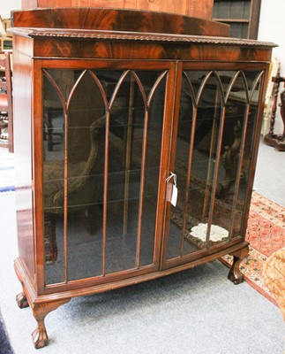 Lot 1318 - A Mahogany Bow Front Display Cabinet, on ball...