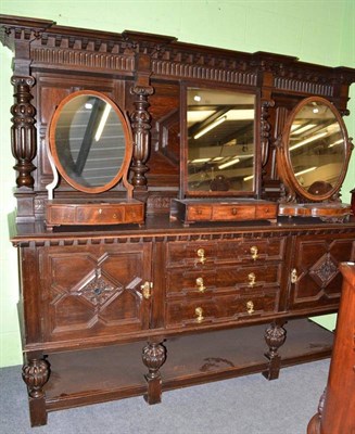 Lot 568 - A large Continental oak dresser and rack