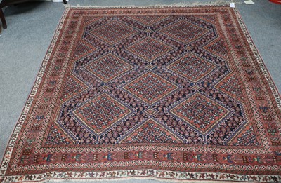 Lot 1087 - An Afshar Rug, the indigo diamond lattice...