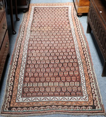 Lot 1089 - A Kurdish Rug, the charcoal field of stlyliced...