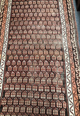 Lot 1089 - A Kurdish Rug, the charcoal field of stlyliced...