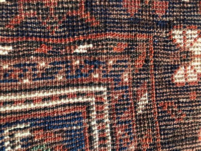 Lot 1089 - A Kurdish Rug, the charcoal field of stlyliced...