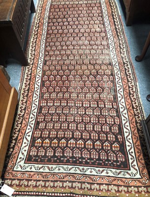 Lot 1089 - A Kurdish Rug, the charcoal field of stlyliced...