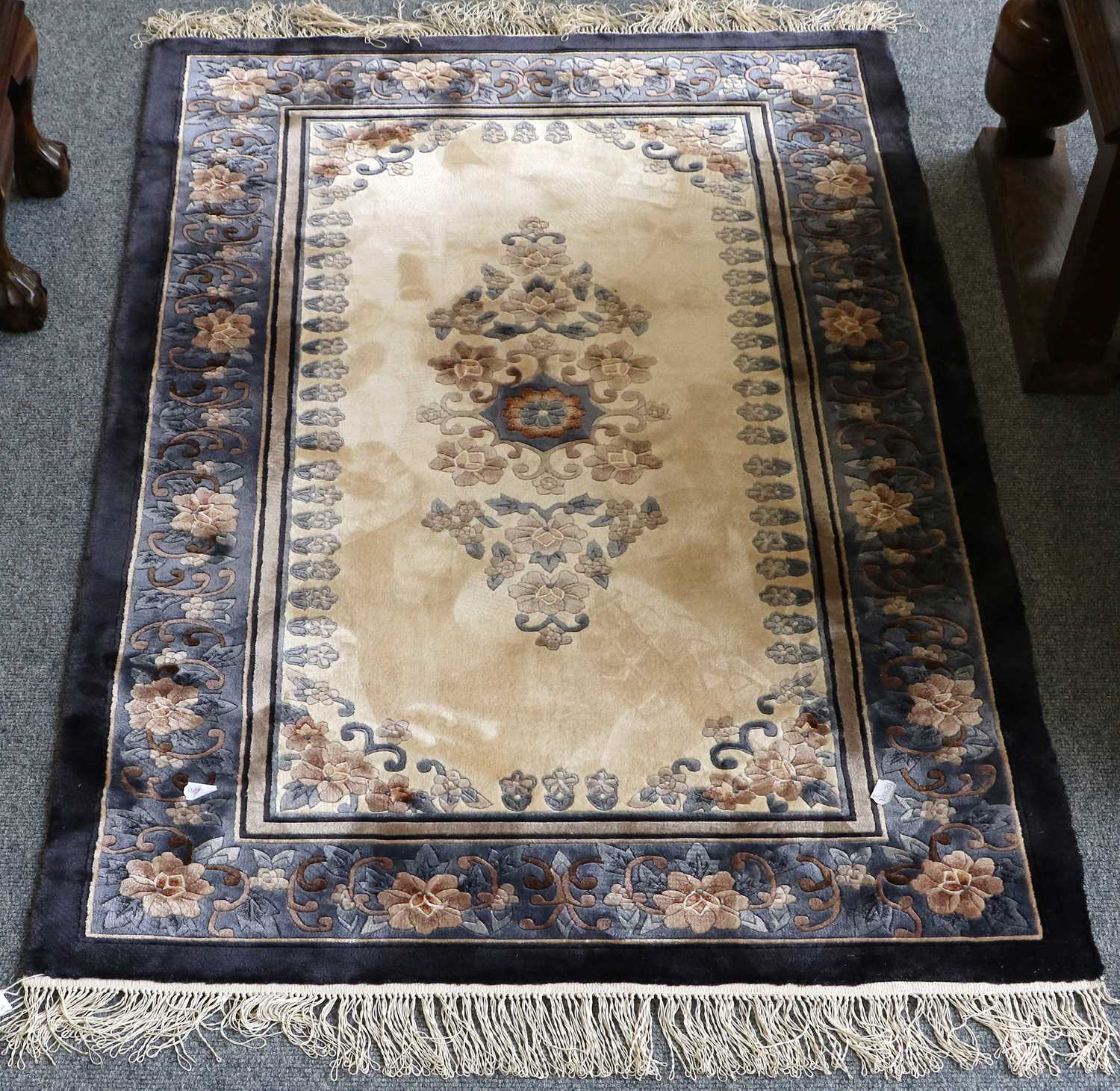 Lot 1097 A Chinese Silk Rug, the ivory field with